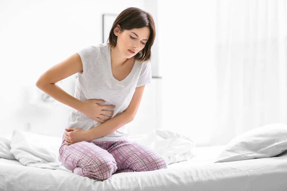 girl having stomach pain due to constipation